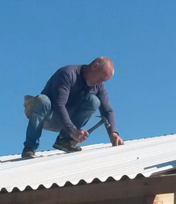 At work on the roof At work on the roof